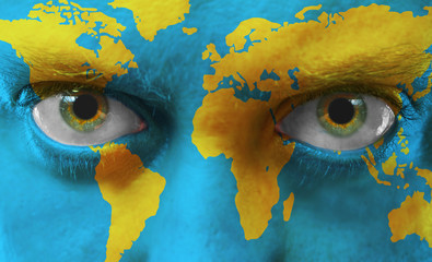 Human face with painted map of world