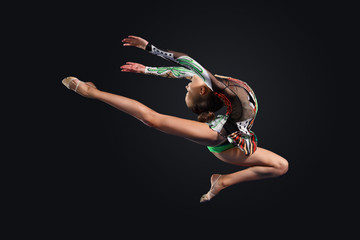 Young woman in gymnast suit posing