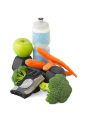 Dumbbells made of broccoli with water bottle, carrots, glove and