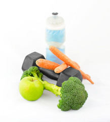 Dumbbells made of broccoli with water bottle and vegetables