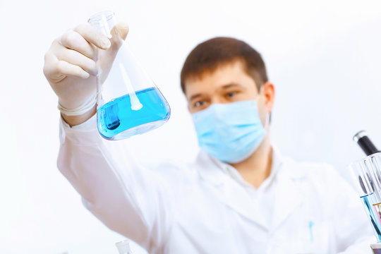 Young Male Scientist Working In Laboratory