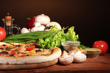 delicious pizza, vegetables and spices