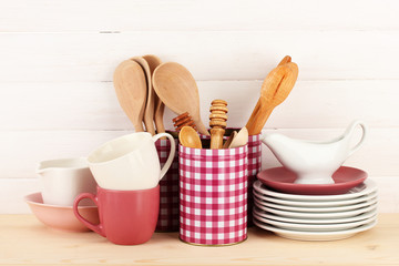 Cups, bowls nd other utensils in metal containers isolated