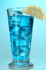 Blue Lagoon cocktail on blue background