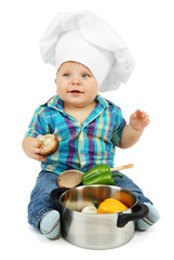 Little boy in chef's hat with pan and vegetables, isolated