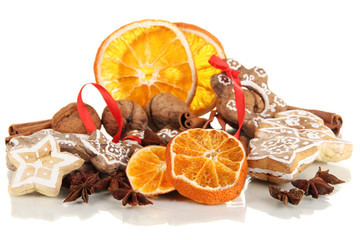 Dried citrus fruits, spices and cookies isolated on white