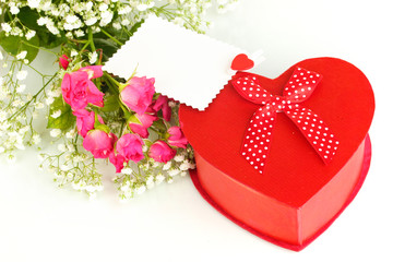 Giftbox and flowers isolated on white