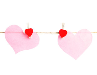 two paper hearts on rope, isolated on white