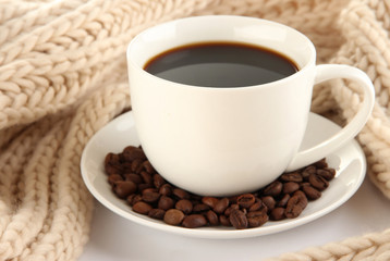 cup of coffee with scarf close-up