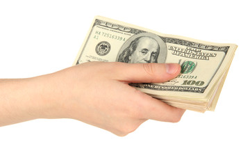 Stack of one hundred dollars banknotes in hand close-up