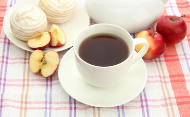 light breakfast with tea and homemade jam, on tablecloth