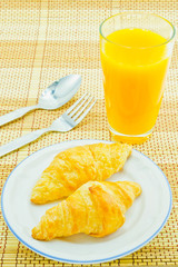Bread of breakfast and orange juice