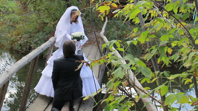 marrying couple.  Guy hands  the girl flowers. wedding