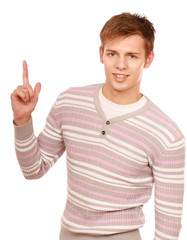 Portrait of a happy young man pointing