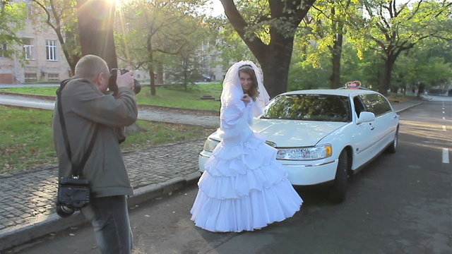 photo of  just marrying  woman near car. Wedding
