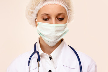 Portrait of serious young woman doctor
