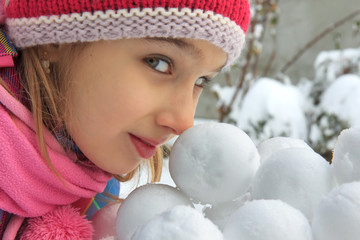 Girl with snowballs
