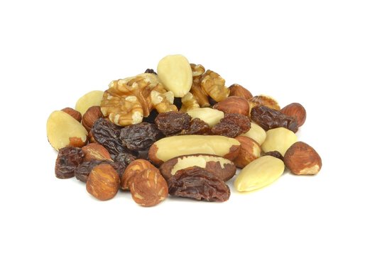A pile of mixed fruit and nuts on a white background