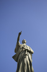 Religious Sculpture against a blue sky in the background