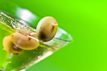 martini with green olives