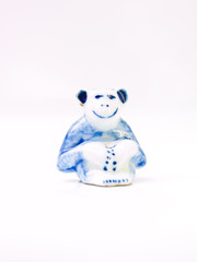 A ceramic doll of light blue monkey isolated on white background