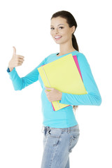 Fototapeta premium Young student woman gesturing OK