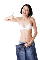 Young happy woman with big pants