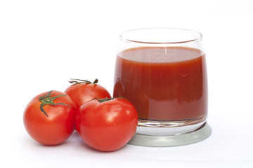 Tomato and juice on the white background