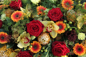 roses and orchids in a flower arrangement