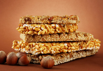 tasty sweets (kozinaki), on brown background