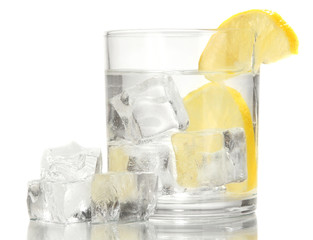 Ice cubes in glass with lemon isolated on white