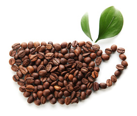 Coffee beans with leaves isolated on white