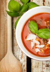 Tasty fresh tomato soup and basil