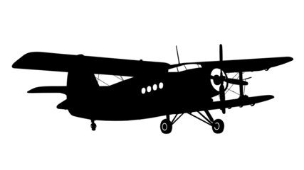 silhouette of a biplane