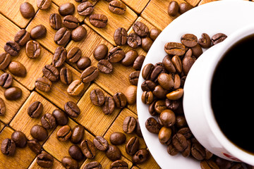 Coffee cup with fresh coffe beans for breakfast