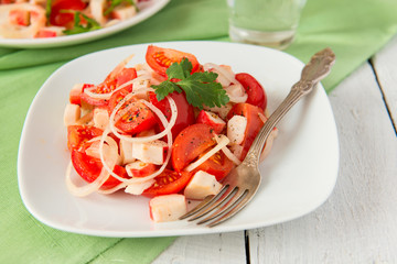 Salad with crab meat and tomatoes