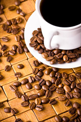Coffee cup with fresh coffe beans for breakfast