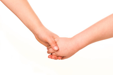 Two kids holding hands together.