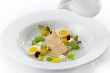 fish fillet with eggs and sauce