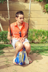 Adult guy in a baby swing recalls childhood