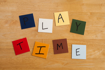 Play Time written on square tiles - education / schools.
