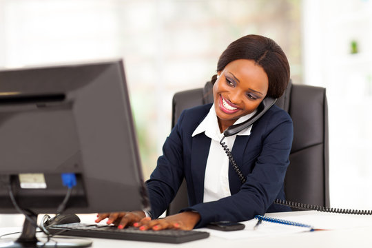 beautiful young african american businesswoman working in office
