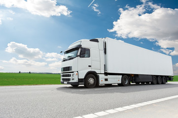 white lorry with trailer over blue sky - obrazy, fototapety, plakaty