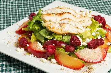 Chicken salad with plums and raspberries