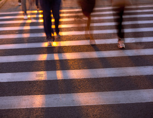 Crowd crossing the street in the crosswalk