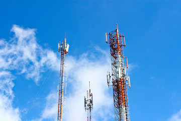 Modern cell and antenna with flat parabola on blue sky