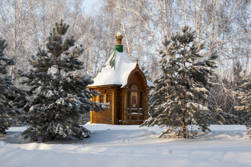 old orthodox church in winter forest