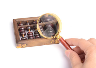 Chinese abacus and Magnifying glass,business concept