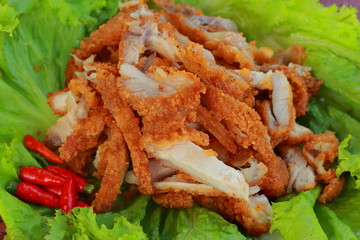 Fried chicken slices on lettuce