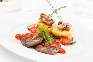 Grilled steak with baked vegetables